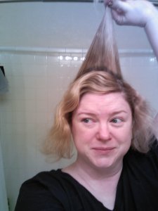 Then, I took down the top section that was pinned up, and separated that into three sections.  I teased the middle back/crown section for some height.