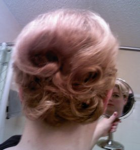 But, I decided that was too many pincurls for the office.  It looked too costume-y.  So I took the back down and modified it into only 5 big curls.