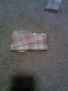 You will want your last fold to be about the same length as your first fold was, so just a little over half of the full length.  See?