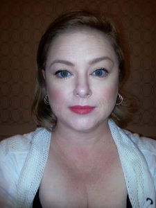 I walked out looking like this.  Same camera angle with flash, and I did my best to make the same facial expression.  Amazing what a little paint can do for a girl!